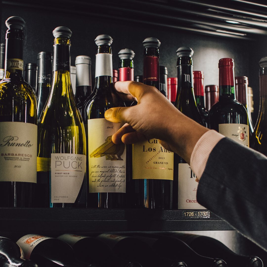 A dish with cauliflower, herbs, and sauce, with roasted cauliflower in the background.